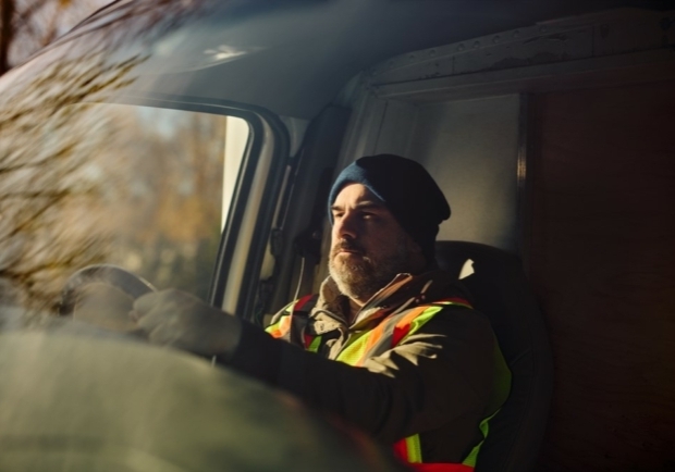 HGV driver driving alone.