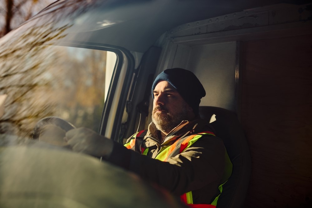 HGV driver driving alone.